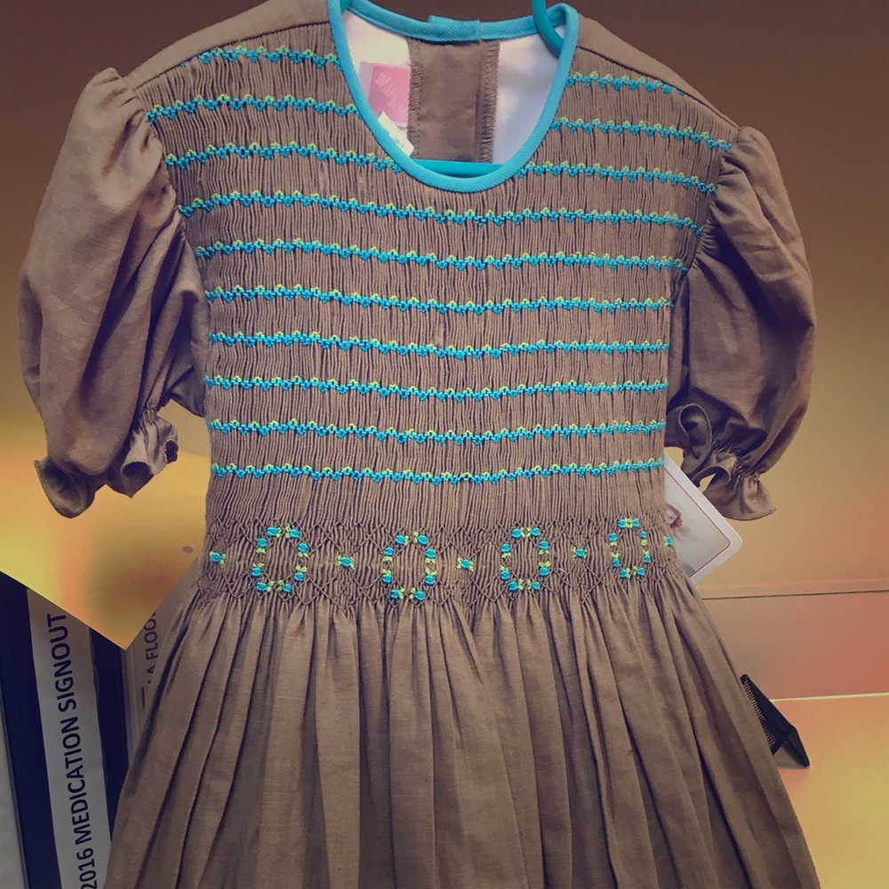 Beautiful brown smocked dress trimmed with teal